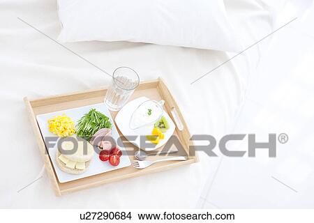 Picture - Breakfast on a bed. Fotosearch