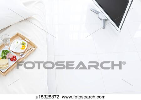 Stock Image - Breakfast on a bed. Fotosearch