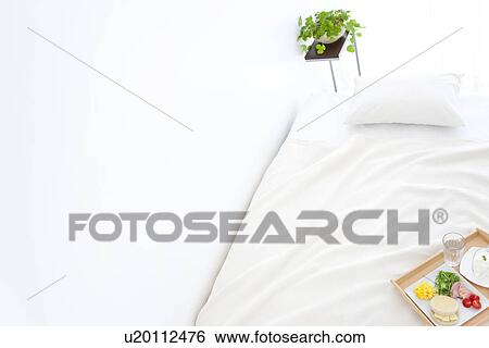 Stock Photograph - Breakfast on a bed. Fotosearch