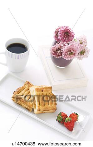 Stock Photography - Breakfast setting with pastry and coffee. Fotosearch