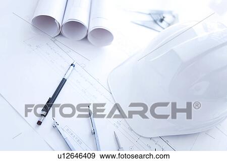 Building plan drawing equipment and a hardhat View Large Photo Image Stock Photo - Building plan drawing equipment and a hardhat. Fotosearch