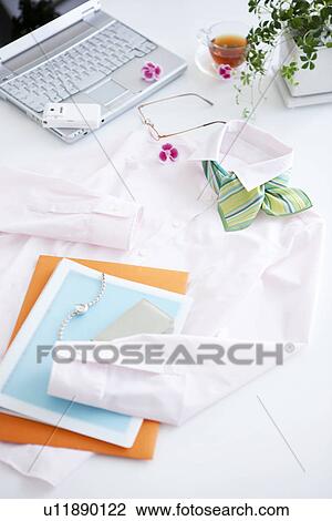 Stock Image - Business clothing and paperwork. Fotosearch