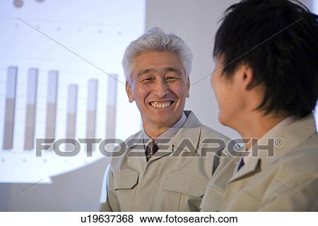 Business colleagues in boardroom View Large Photo Image Stock Photo - Business colleagues in boardroom. Fotosearch
