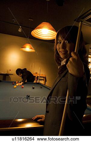 Picture - Business colleagues playing pool. Fotosearch