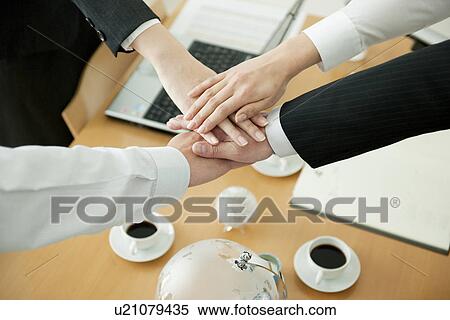 Stock Photography - Business partners with hands together. Fotosearch