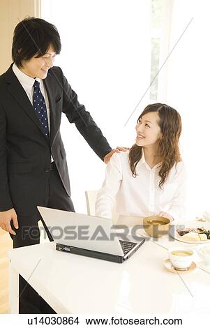 Businessman and woman talking at dining table View Large Photo Image Picture - Businessman and woman talking at dining table. Fotosearch