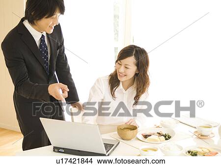 Businessman and woman talking at dining table View Large Photo Image Picture - Businessman and woman talking at dining table. Fotosearch