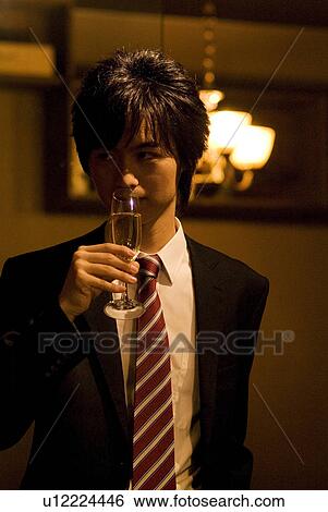 Stock Photograph - Businessman drinking champagne. Fotosearch