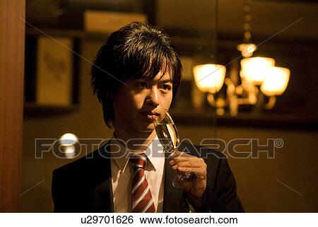 Stock Photograph - Businessman drinking champagne. Fotosearch