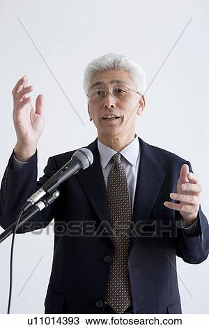 Businessman giving a presentation View Large Photo Image Stock Image - Businessman giving a presentation. Fotosearch