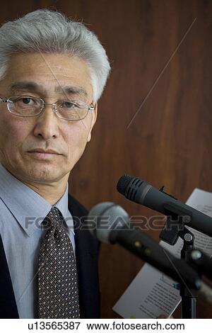 Stock Photo - Businessman giving a presentation. Fotosearch