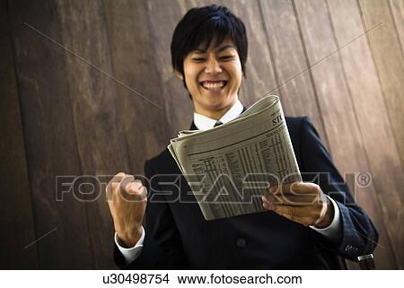 Picture - Businessman in a victory pose. Fotosearch