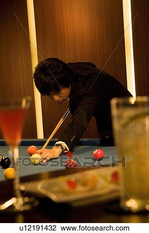 Businessman playing pool View Large Photo Image Stock Image - Businessman playing pool. Fotosearch