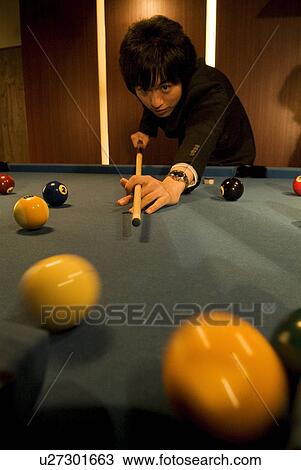 Businessman playing pool View Large Photo Image Stock Image - Businessman playing pool. Fotosearch
