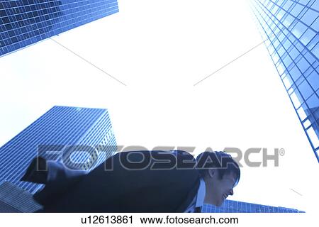 Businessman running in street View Large Photo Image Stock Image - Businessman running in street. Fotosearch