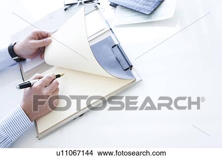 Businessman with paperwork View Large Photo Image Picture - Businessman with paperwork. Fotosearch