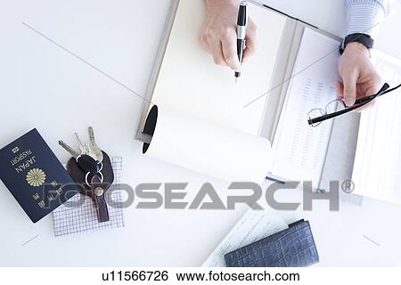 Stock Photograph - Businessman with paperwork. Fotosearch