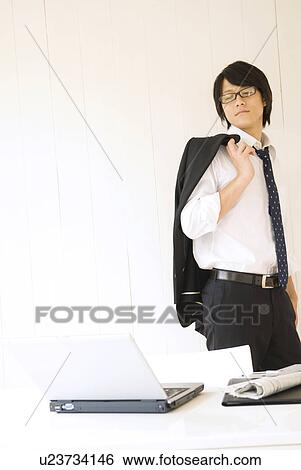 Stock Photograph - Businessman with suit jacket over shoulder. Fotosearch