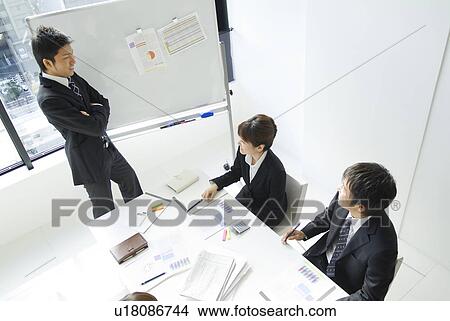 Businessmen and a businesswoman in a conference View Large Photo Image Picture - Businessmen and a businesswoman in a conference. Fotosearch