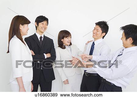 Businesspeople talking and smiling View Large Photo Image Stock Photo - Businesspeople talking and smiling. Fotosearch