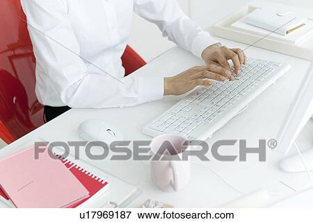 Businessperson typing on computer keyboard View Large Photo Image Stock Photo - Businessperson typing on computer keyboard. Fotosearch