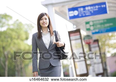 Businesswoman at bus stop View Large Photo Image Stock Image - Businesswoman at bus stop. Fotosearch