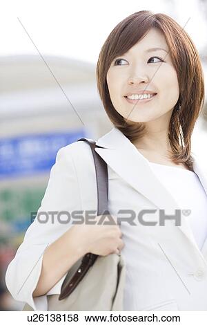 Businesswoman at bus stop View Large Photo Image Stock Photo - Businesswoman at bus stop. Fotosearch