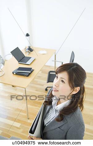Businesswoman carrying files View Large Photo Image Stock Photography - Businesswoman carrying files. Fotosearch