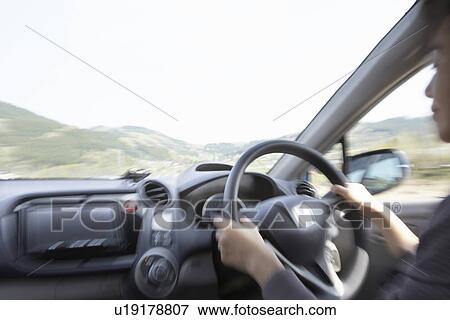 Businesswoman driving a car with GPS View Large Photo Image Stock Photo - Businesswoman driving a car with GPS. Fotosearch