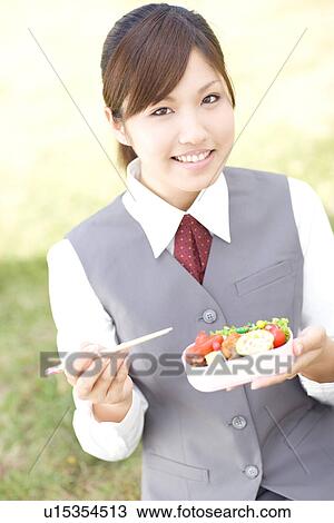 Businesswoman eating lunch outside View Large Photo Image Stock Image - Businesswoman eating lunch outside. Fotosearch