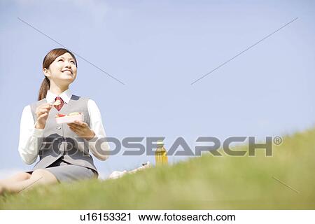 Businesswoman eating lunch outside View Large Photo Image Stock Image - Businesswoman eating lunch outside. Fotosearch