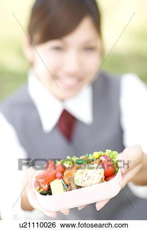 Businesswoman eating lunch outside View Large Photo Image Stock Photograph - Businesswoman eating lunch outside. Fotosearch