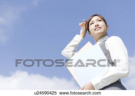Businesswoman holding documents View Large Photo Image Stock Photography - Businesswoman holding documents. Fotosearch