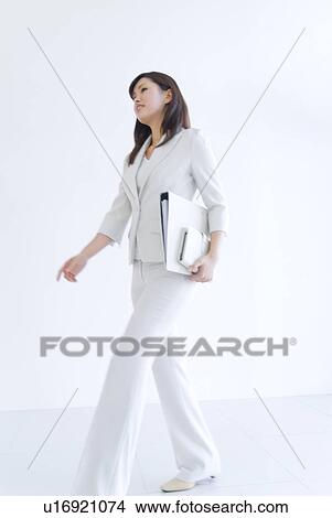 Picture - Businesswoman holding files. Fotosearch