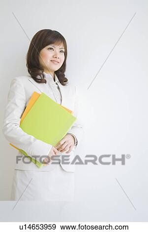 Businesswoman holding files View Large Photo Image Stock Photo - Businesswoman holding files. Fotosearch