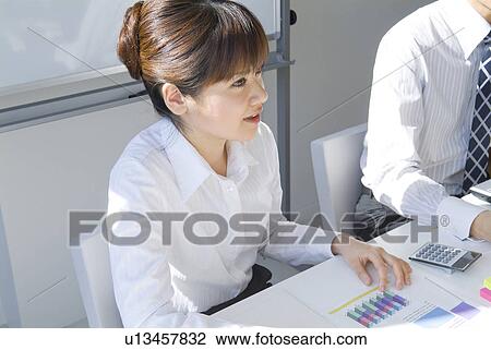 Businesswoman in a meeting View Large Photo Image Stock Image - Businesswoman in a meeting. Fotosearch
