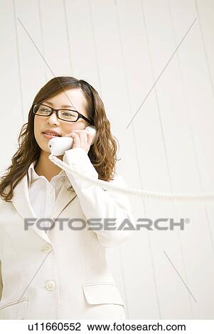 Stock Image - Businesswoman on the phone. Fotosearch