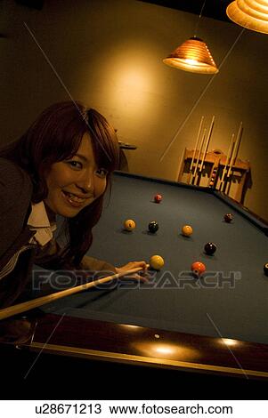 Businesswoman playing pool View Large Photo Image Stock Image - Businesswoman playing pool. Fotosearch