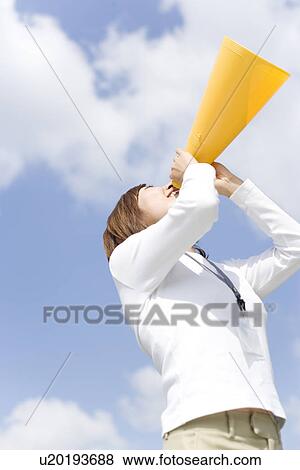 Stock Photo - Businesswoman shouting into megaphone. Fotosearch