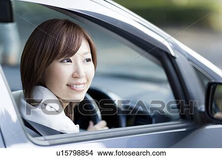 Businesswoman sitting in car View Large Photo Image Picture - Businesswoman sitting in car. Fotosearch