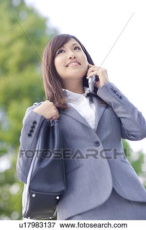Businesswoman talking on mobile phone View Large Photo Image Stock Photo - Businesswoman talking on mobile phone. Fotosearch