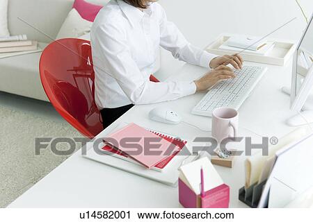 Businesswoman typing on computer keyboard View Large Photo Image Stock Image - Businesswoman typing on computer keyboard. Fotosearch