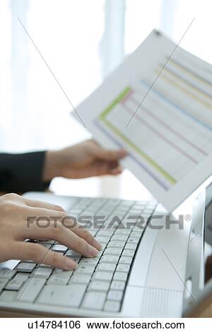 Businesswoman typing on laptop View Large Photo Image Stock Photograph - Businesswoman typing on laptop. Fotosearch