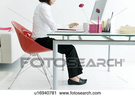Businesswoman using computer View Large Photo Image Stock Image - Businesswoman using computer. Fotosearch