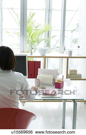 Stock Photograph - Businesswoman using computer. Fotosearch