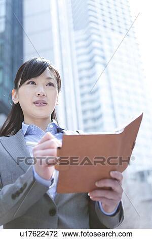 Businesswoman with address book View Large Photo Image Stock Image - Businesswoman with address book. Fotosearch