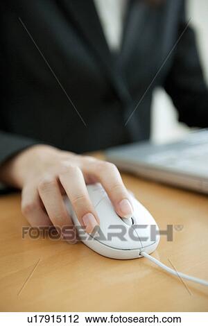 Businesswoman with hand on computer mouse View Large Photo Image Stock Image - Businesswoman with hand on computer mouse. Fotosearch