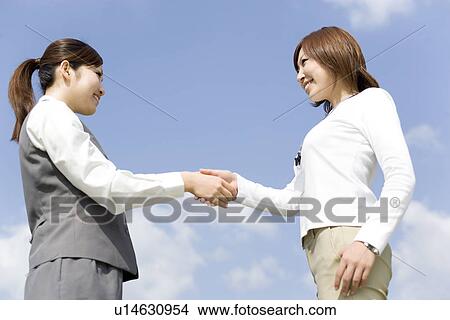 Businesswomen shaking hands View Large Photo Image Picture - Businesswomen shaking hands. Fotosearch