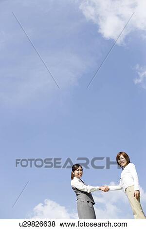 Businesswomen shaking hands View Large Photo Image Stock Photo - Businesswomen shaking hands. Fotosearch