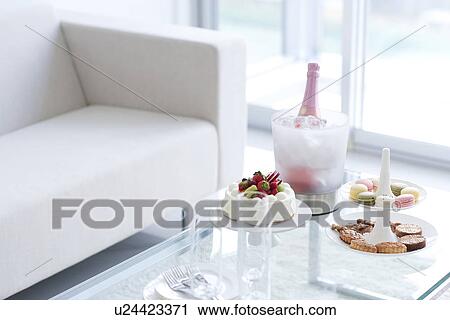 Cakestand with cookies, cake and an ice bucket with champagne View Large Photo Image Stock Image - Cakestand with cookies, cake and an ice bucket with champagne. Fotosearch
